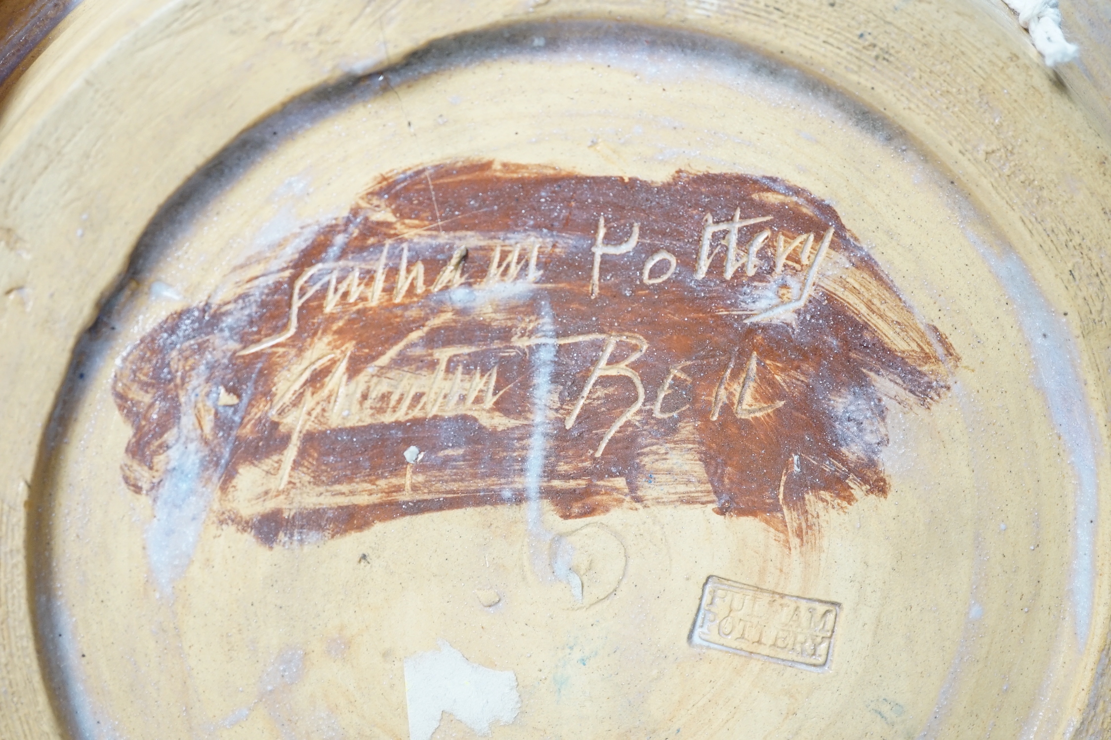 Quentin Bell (1910-1996) - Fulham pottery dish with stylised decoration, signed and stamped to the base (cracked), 24.5cm in diameter